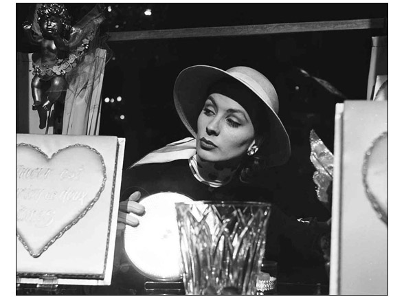 Suzy Parker in the chocolate maker window